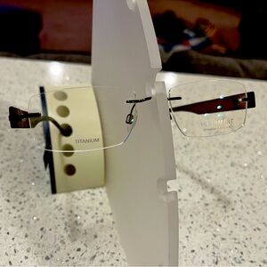 New from Stock Charmant Titanium Rimless Frame in Brown - Either Gender